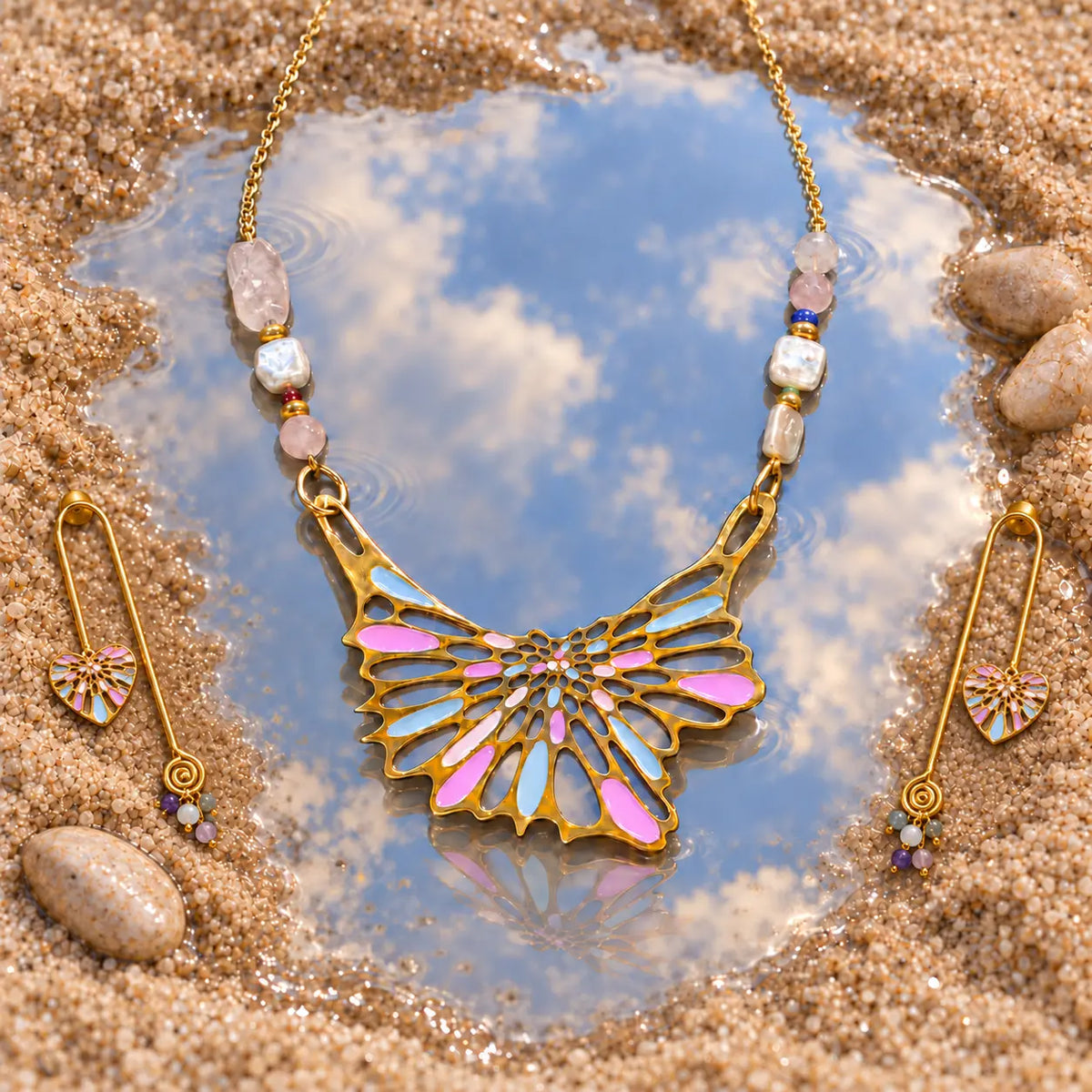 Matching gold plated wing pendant necklace & earrings with pink & blue enamel, rose quartz & pearl accents. Handcrafted, Ankkshi Aakar collection.