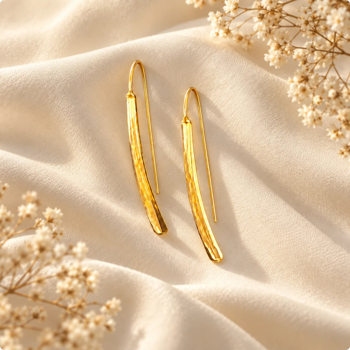 Slim hammered gold plated threader earrings with a softly curved bar and a light-catching finish. Ankkshi's Aakar collection.