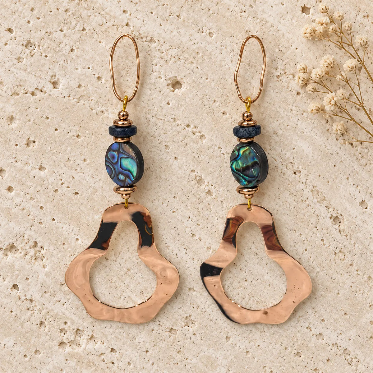 Sculptural 18k gold plated earrings with abalone shell and a hammered open drop. Ankkshi's Aakar collection.