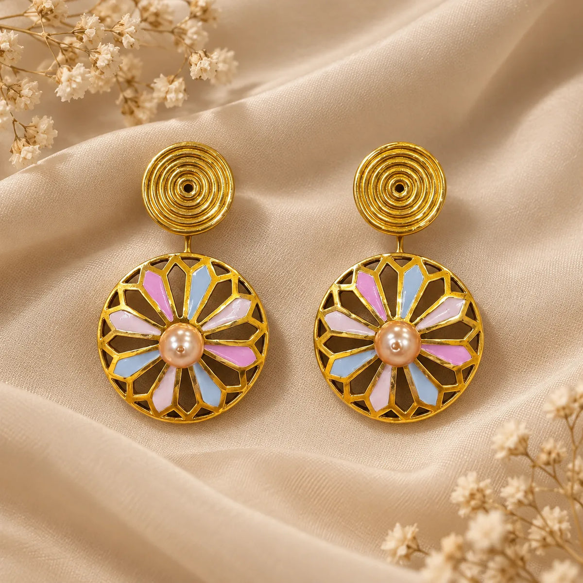 Gold plated fan-cut medallion earrings with pink & blue enamel and a pink pearl accent. Ankkshi's Aakar collection.