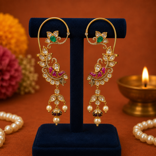 Kashmiri Morvina enamel ear cuff by Ankkshi featuring a peacock motif, kundan stones, pearl drops and antique gold finish