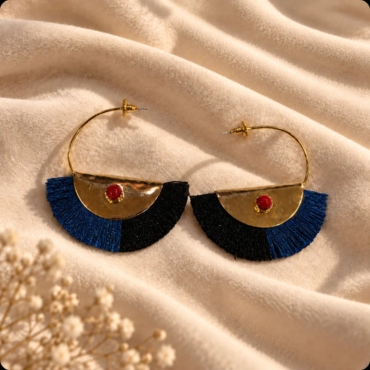 Bold gold plated fan hoops with red jasper centre stone and navy-black silk tassel fringe. Ankkshi's Aakar collection.