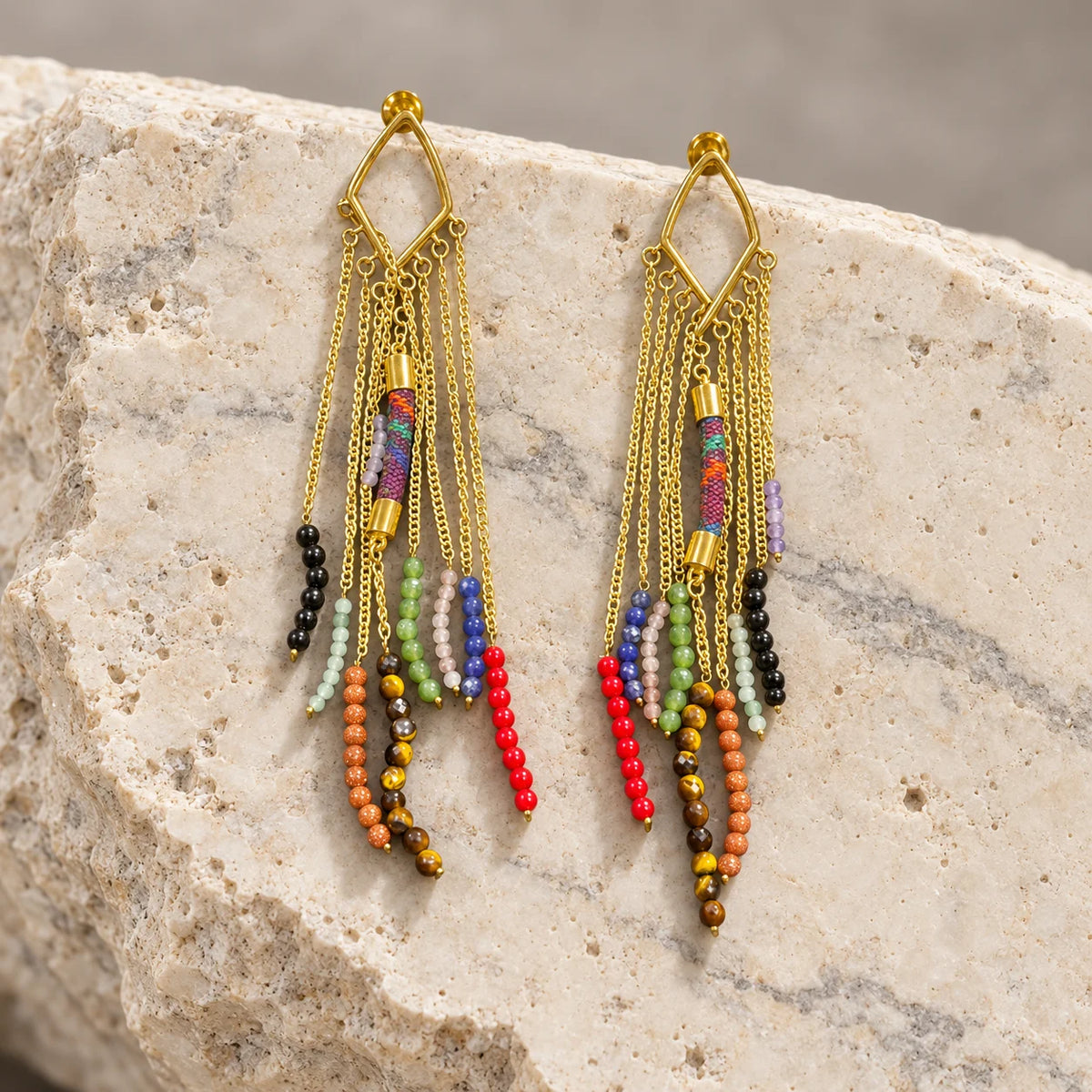 Vibrant 18k gold plated fringe earrings with mixed gemstone bead strands and woven fabric detail. Ankkshi's Aakar collection.