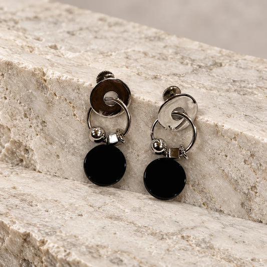 Minimal 18k gold plated earrings with an organic disc link and black jasper drop. Ankkshi's Aakar collection.