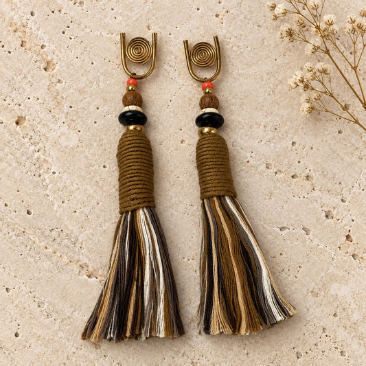 Multi-toned cotton tassel earrings with wood and coral bead accents. Handcrafted, earthy design from Ankkshi's Aakar collection.