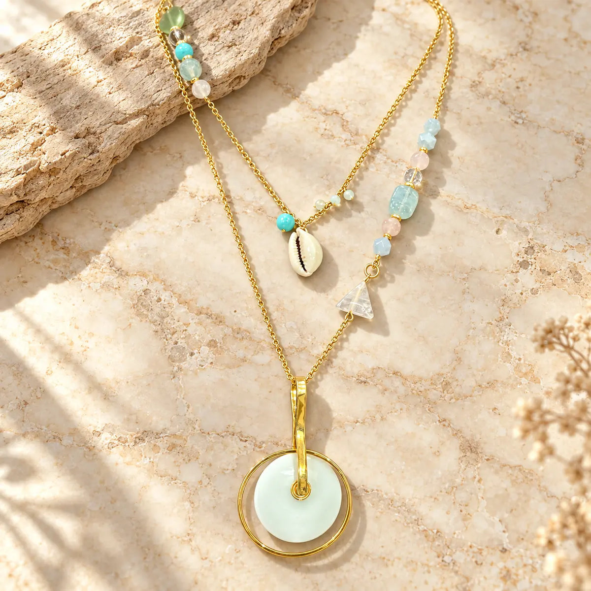 Layered necklace with genuine turquoise, rose quartz, aquamarine & cowrie shell charm. Handcrafted design from Ankkshi's Aakar collection.