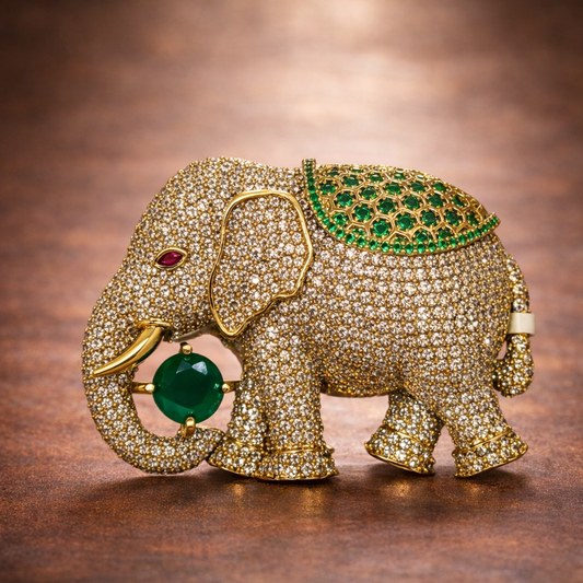 Gold elephant brooch with emerald stone by Ankkshi