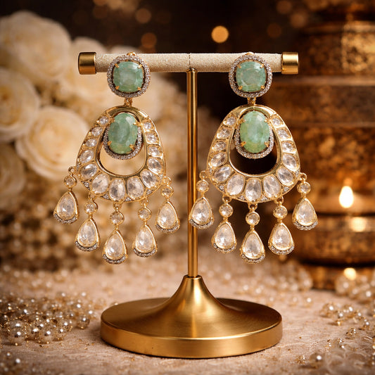 Mint green kundan chandelier earrings with gold detailing and teardrop accents